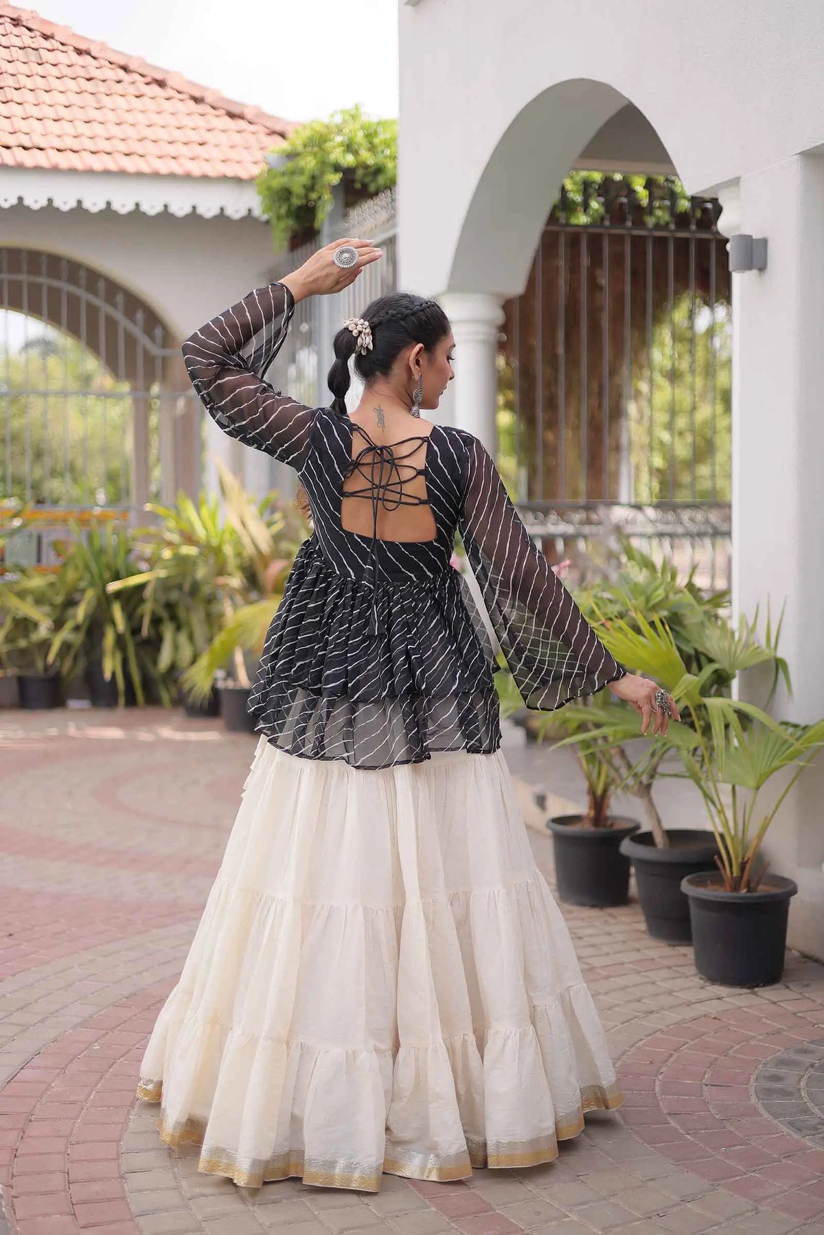 Black Peplum Style Blouse And Lehenga
