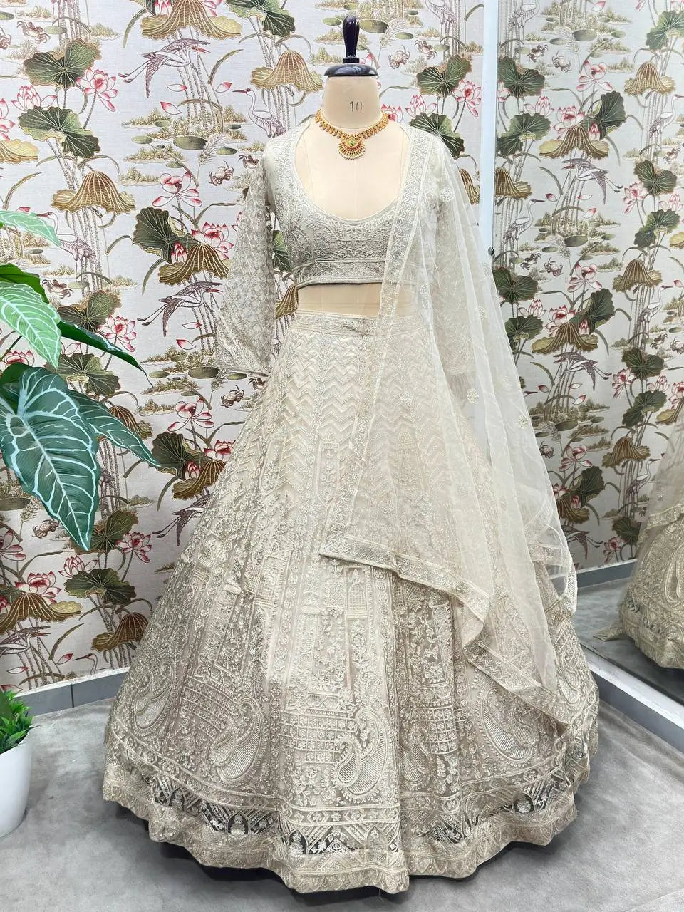 Beige Shining Thread Embroidery Design Net Lehenga Choli