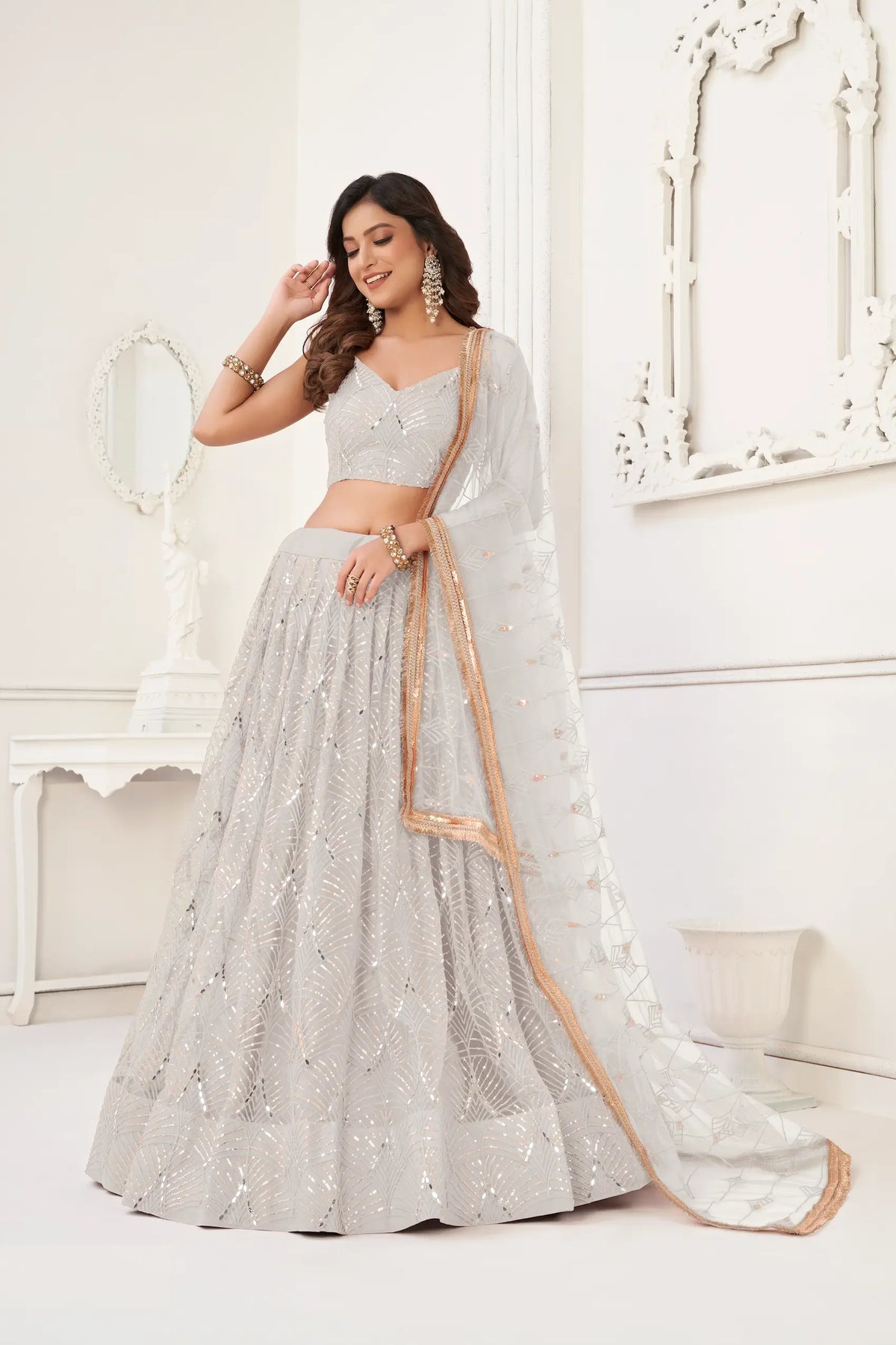 Off White Net Embroidery Lehenga Choli